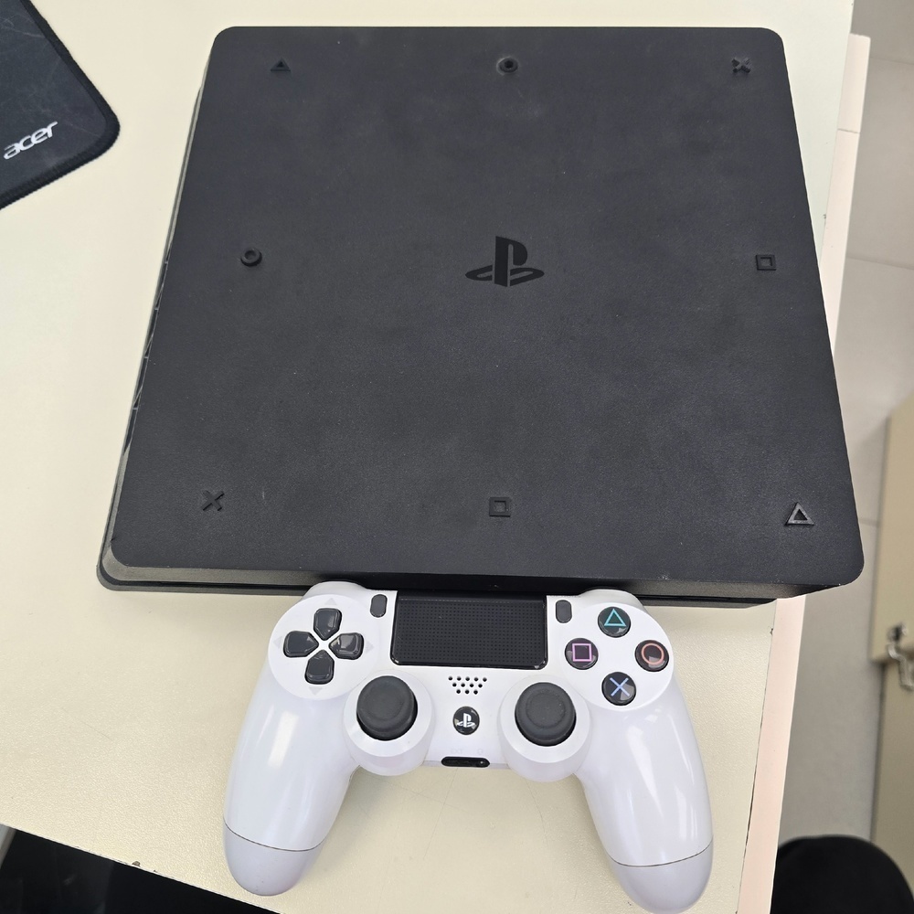 Игровая приставка PlayStation 4 Slim 1Tb Игровая приставка PlayStation 4 Slim 1Tb